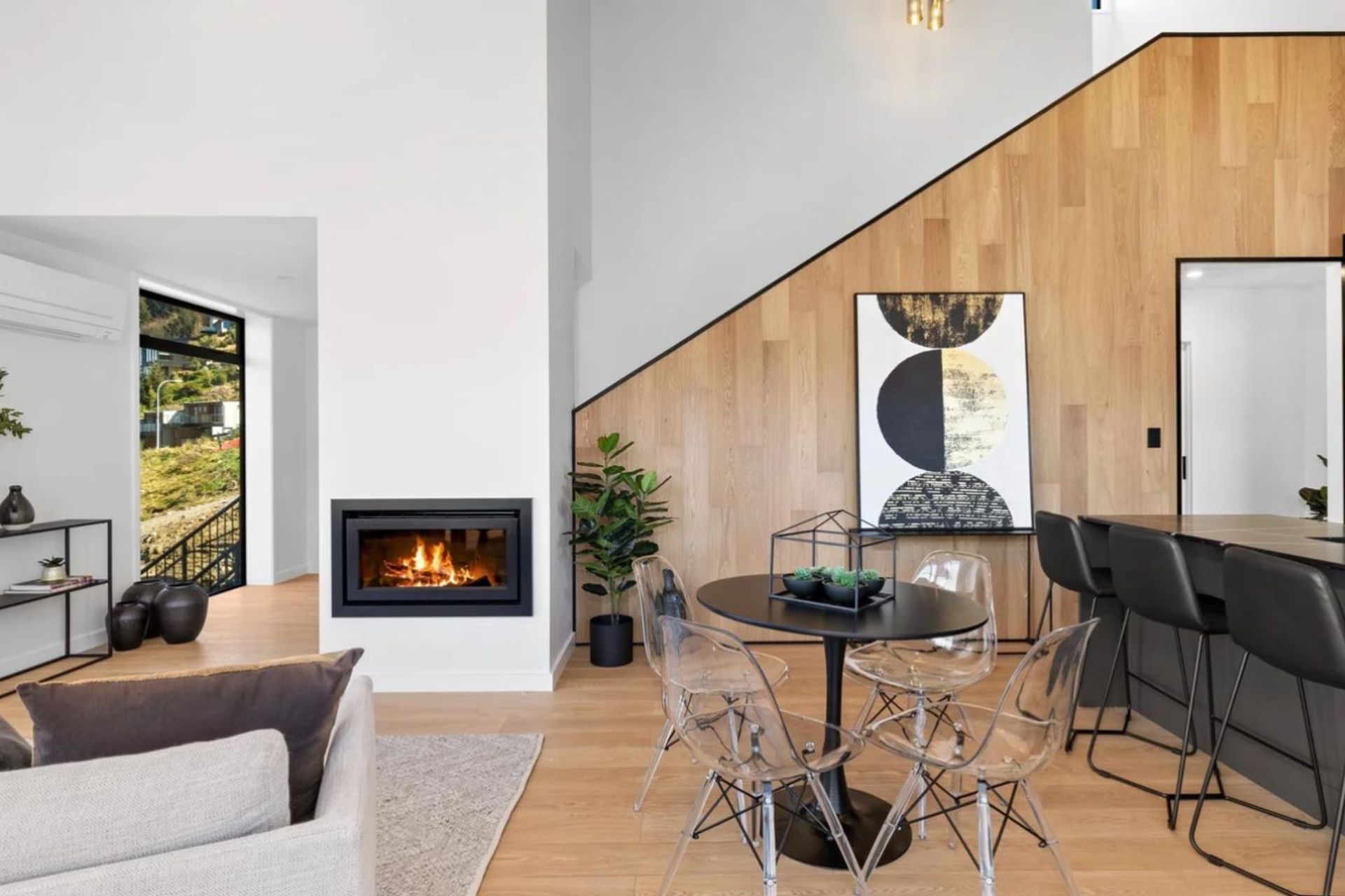 Timber feature wall and cosy Escea gas fireplace.