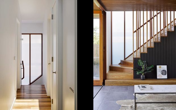 A split architectural interior view showing a bright narrow hallway with white walls, timber flooring and a glazed timber-framed door, alongside an entry/living area with a timber staircase, vertical timber balustrade, dark wall panelling, timber ceiling, large glazing and stone-look flooring. The space has a refined contemporary character with warm natural timber and strong black-and-white contrast.