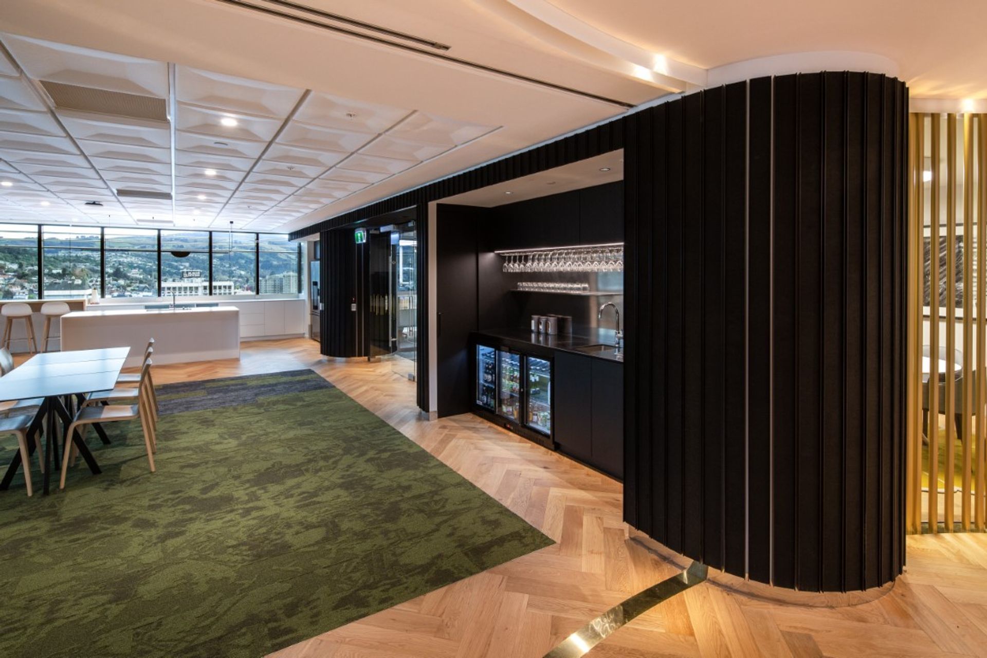 Cafe - kitchen &amp; bar amenities within dark acoustic wall