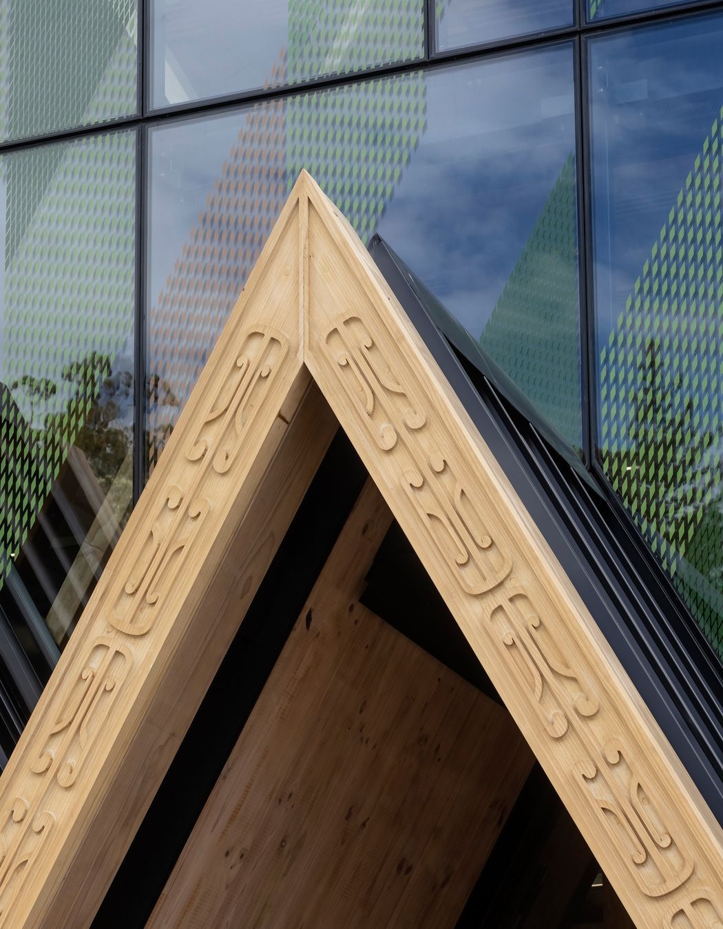 Machine-routed carving, designed by local carver Grant Marunui, adorns the 'triple peak' entrance to the centre.