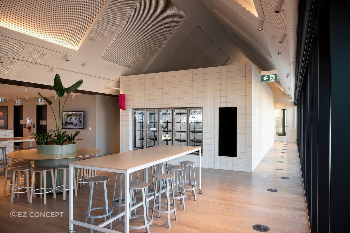 The completed kitchen with a large fridge installed in the opening.