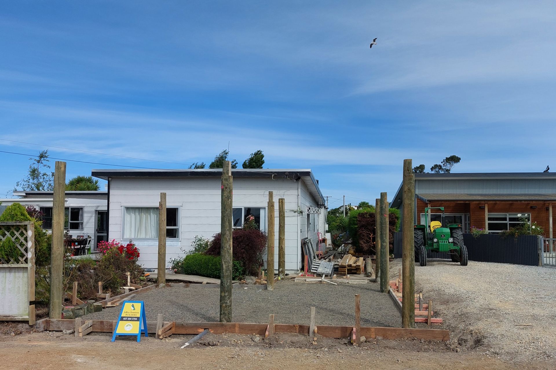 Formwork for concrete floor in place, poles checked out ready for rafters