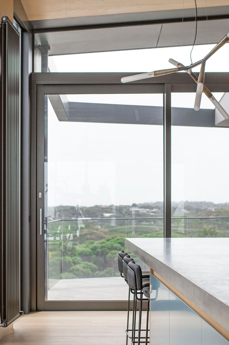 Distant coastal views imbue the elevated kitchen space with a sense of openness