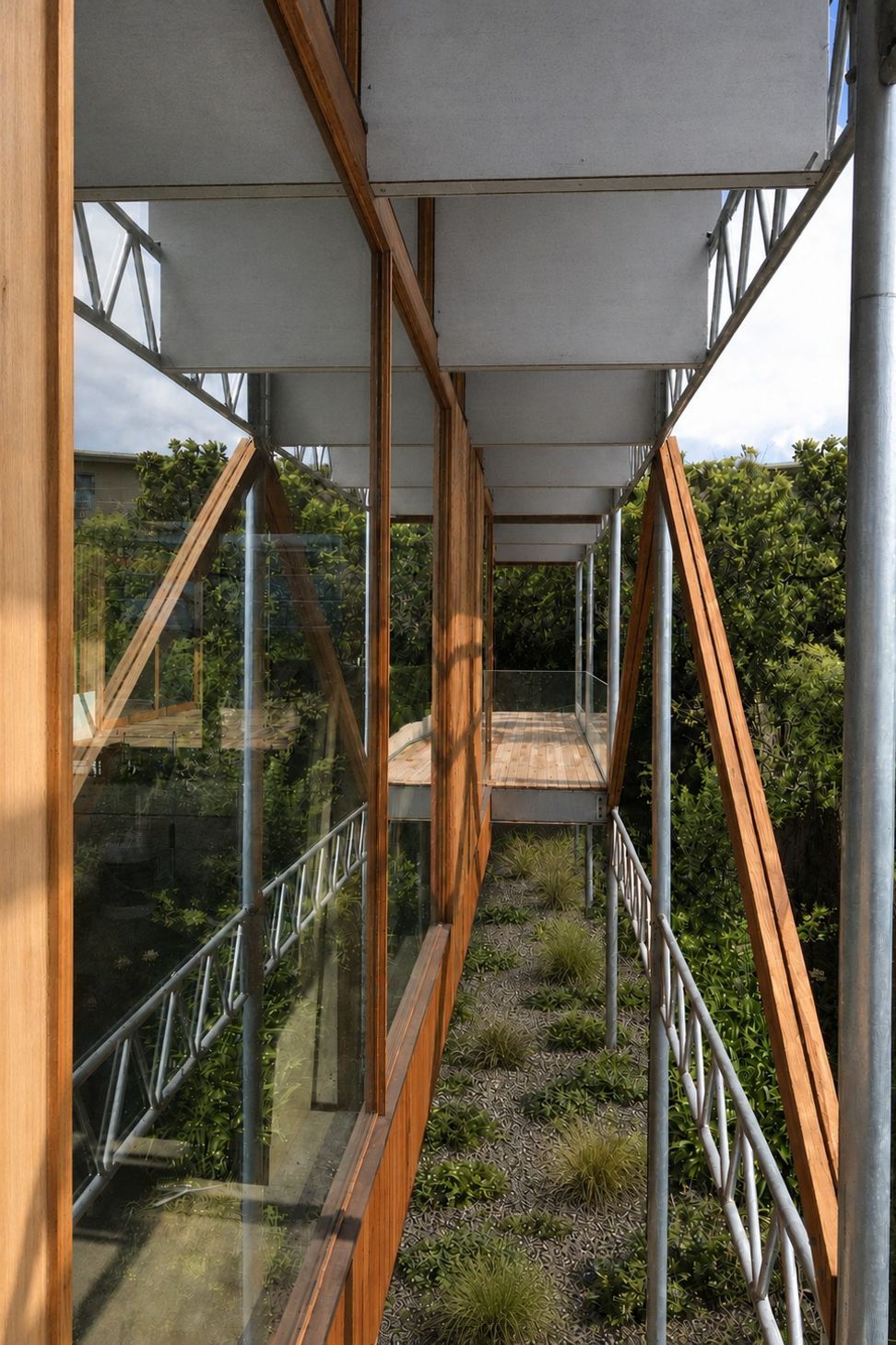 Exposed lightweight web steel trusses support the elevated timber-framed glass pavilion over a native garden landscape