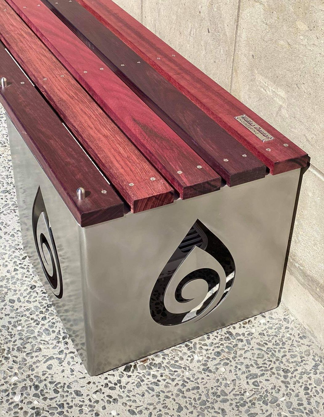 Laser cut logo on stainless steel close up