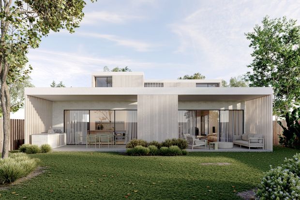 Contemporary two-storey residence viewed from the landscaped front garden, with a broad flat-roofed ground-floor volume, deep covered outdoor spaces, full-height glazed sliding doors, vertical ribbed wall surfaces, and a smaller upper-level pavilion. The facade is light and neutral, framed by mature planting and lawn.
