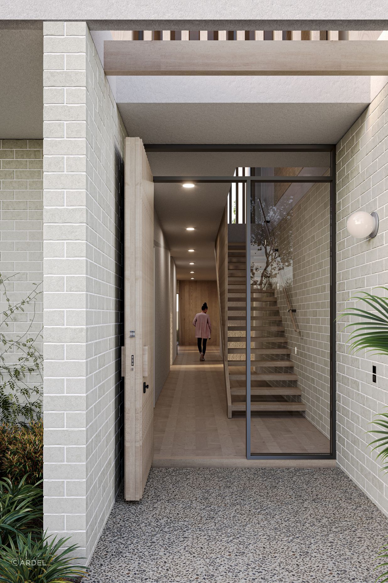  Bordered by light concrete brick walls, Cantilever’s entrance ushers natural light into the home via an open roof structure that compliments the entry. To the right, a double fronted garage hides discretely behind a pale timber façade, slotting carefully into the design of the built form.
