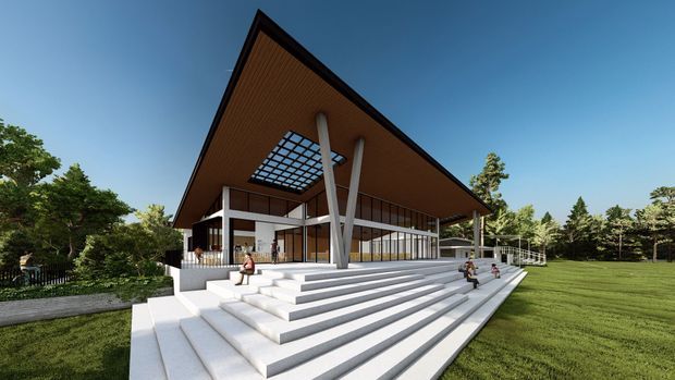 Architectural rendering of a large pavilion-like modern building set in a landscaped park. The structure features a dramatically pitched roof with a warm timber soffit, extensive floor-to-ceiling glazing, slender structural columns, a central grid-like skylight or roof opening, and broad white stepped terraces leading to the lawn.