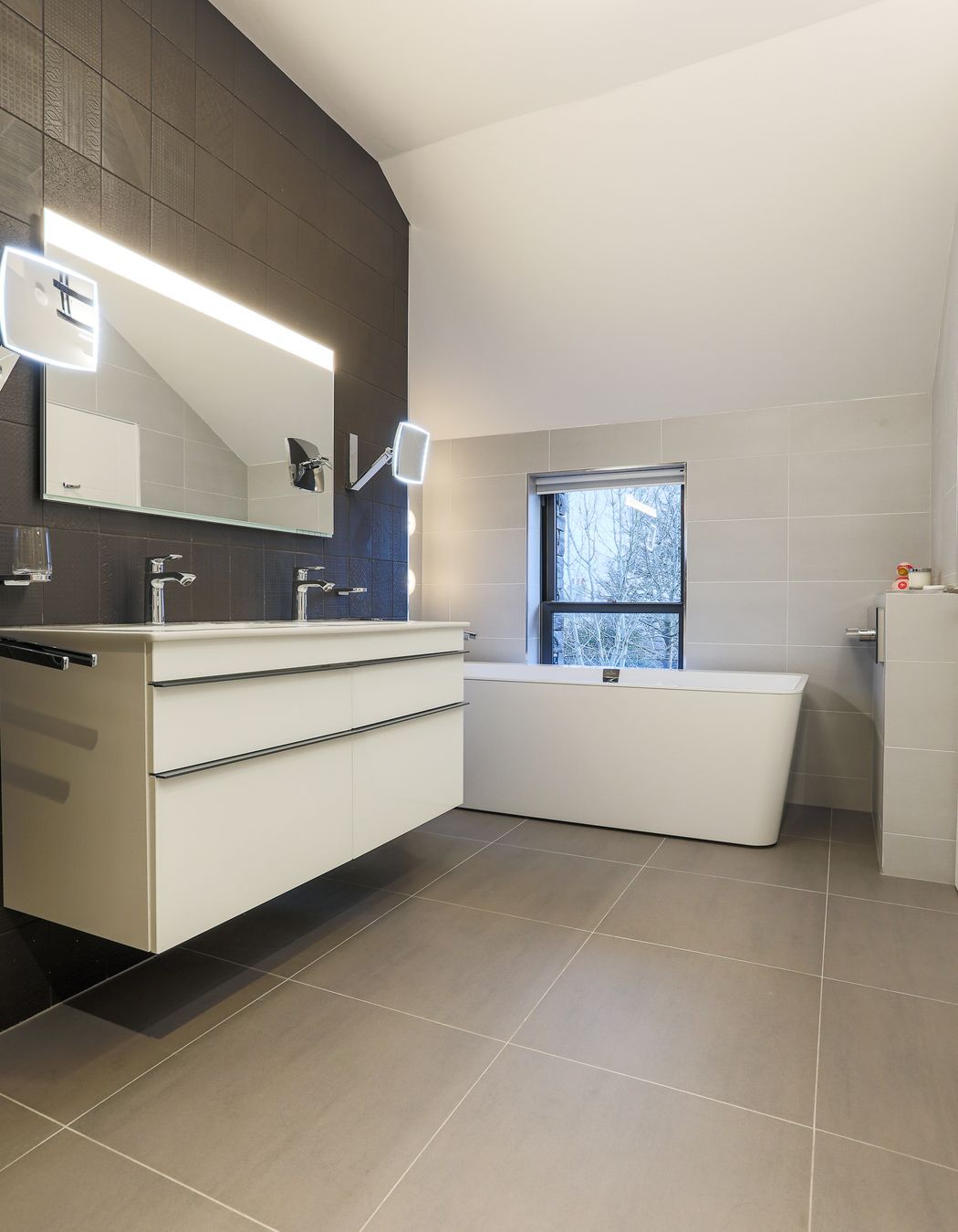 The Master ensuite walls were clad in handmade tiles, creating interest with pattern and texture.