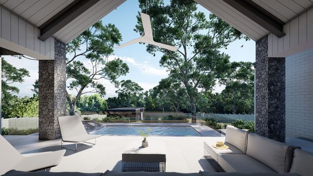 Open-plan covered outdoor lounge with a dramatic pitched timber-lined roof, stone-clad structural columns, pale tiled flooring, and a large ceiling fan. The space opens directly onto a swimming pool and landscaped garden, with a built-in or outdoor seating arrangement and low coffee table. The scene has a refined contemporary resort-like character with strong indoor-outdoor connection.
