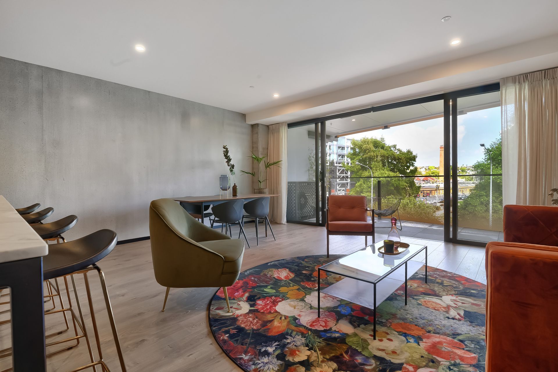 Full-height, full-width glazing is a feature of the park-facing apartments, bringing the outdoors to the fore and complementing the pared back palette.