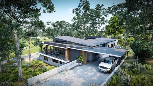 A rendered aerial exterior view of a contemporary multi-wing residence set within a heavily landscaped, leafy suburban or semi-rural site. The home has a low-slung flat roof, layered projecting volumes, extensive glazing, dark and light exterior finishes, a covered carport with a vehicle, paved driveway, and a low masonry boundary wall. A broad green open space is visible beyond the property.