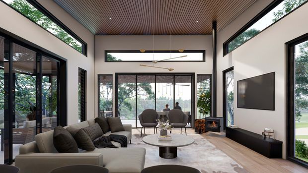 A spacious contemporary living room with a high slatted timber ceiling, expansive black-framed glazing, and a large central glass opening to the outdoors. The room includes a sectional sofa, lounge chairs, round coffee table, wall-mounted television, low media cabinetry, and a freestanding wood-burning stove. Neutral upholstered furniture and pale walls contrast with dark window frames and warm timber detailing.