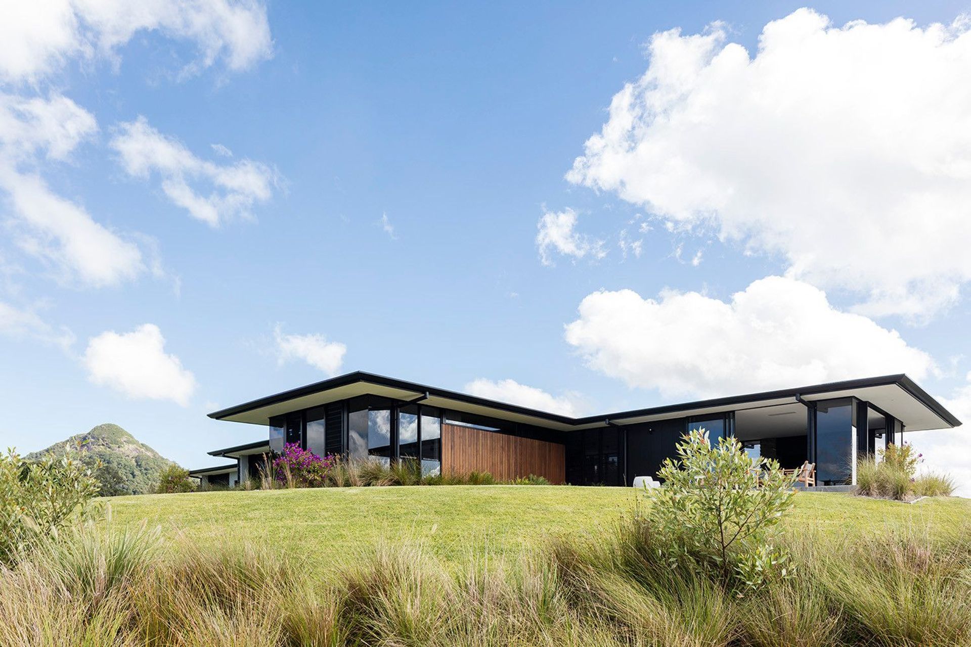 Clark Residence - Exterior. The home sitting low in the rolling Eumundi hinterland.