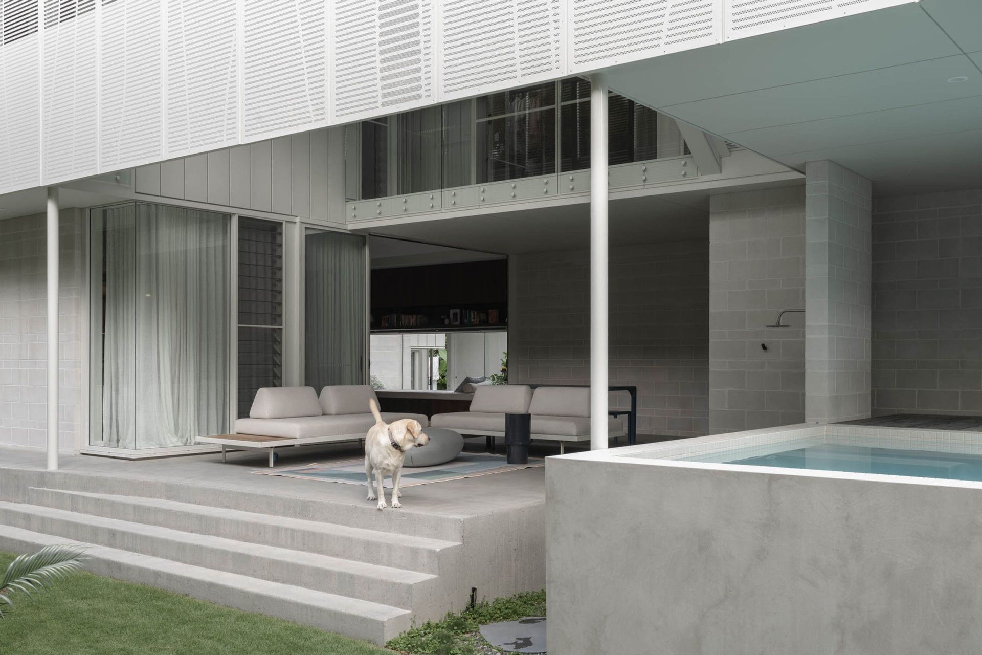 Eleutheria - Patio. Outdoor lounge and plunge pool beneath the perforated upper level.