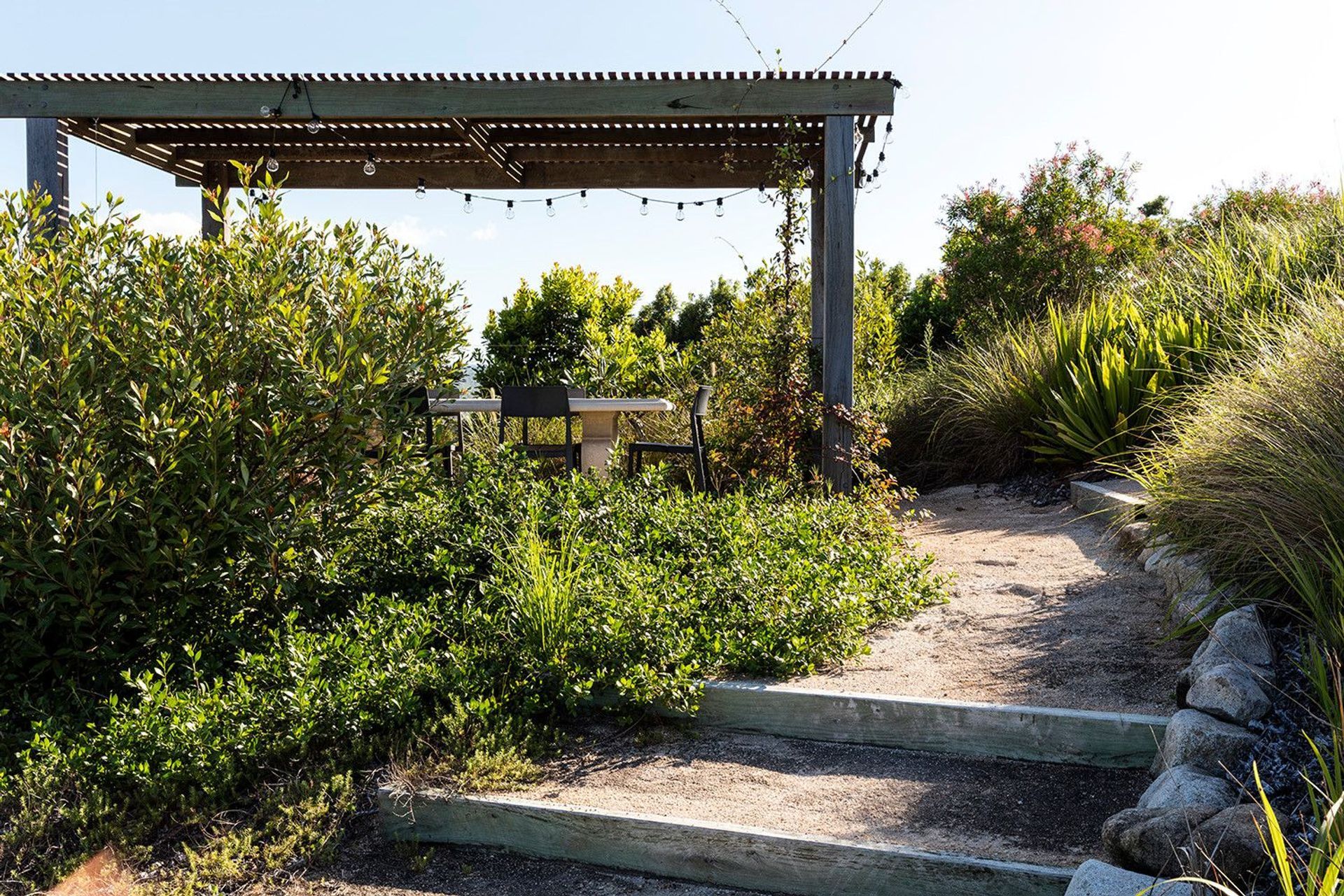 Clark Residence - Garden. Garden path leading under a timber pergola.