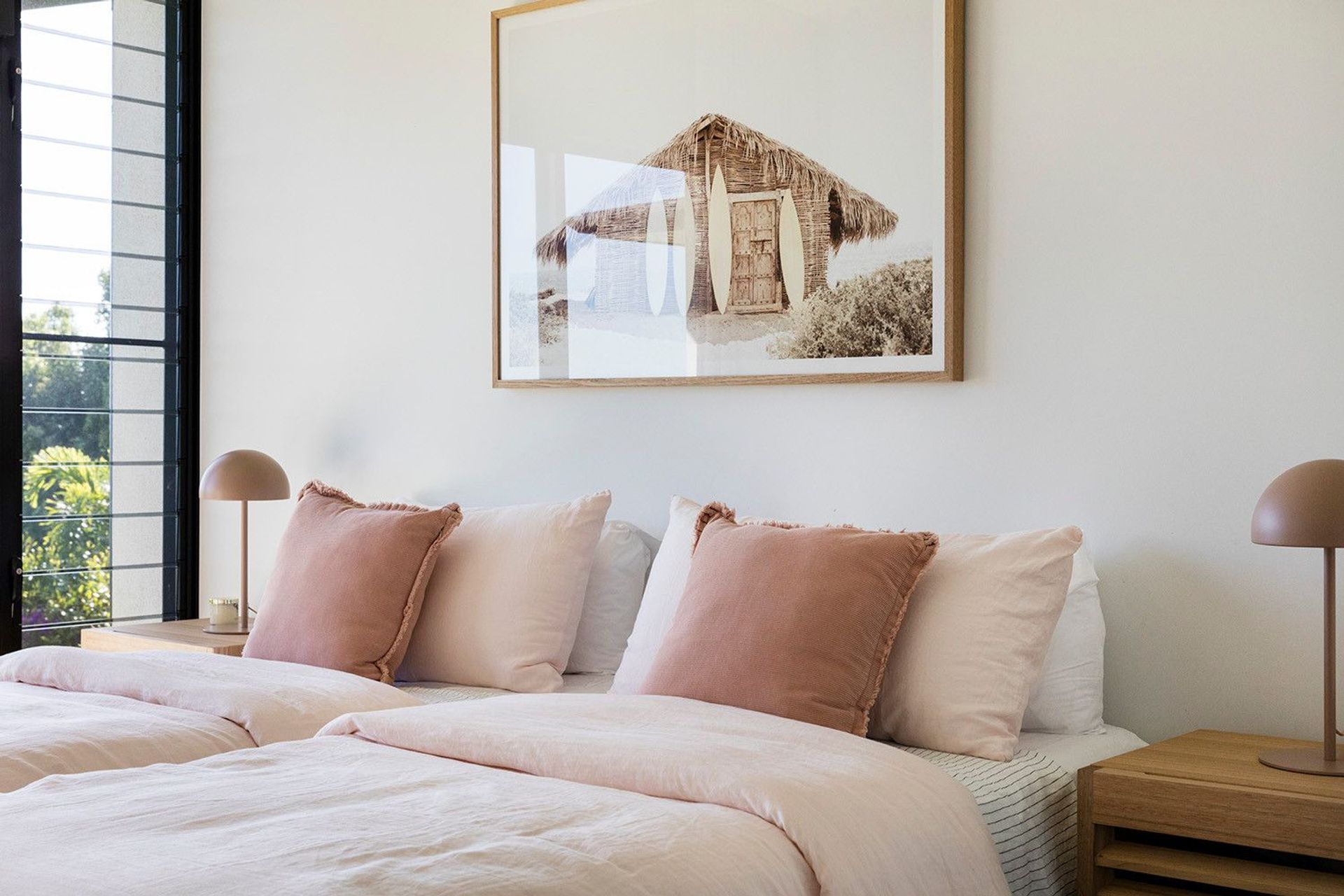 Clark Residence - Bedroom. Bedroom with soft linen and pink cushions.