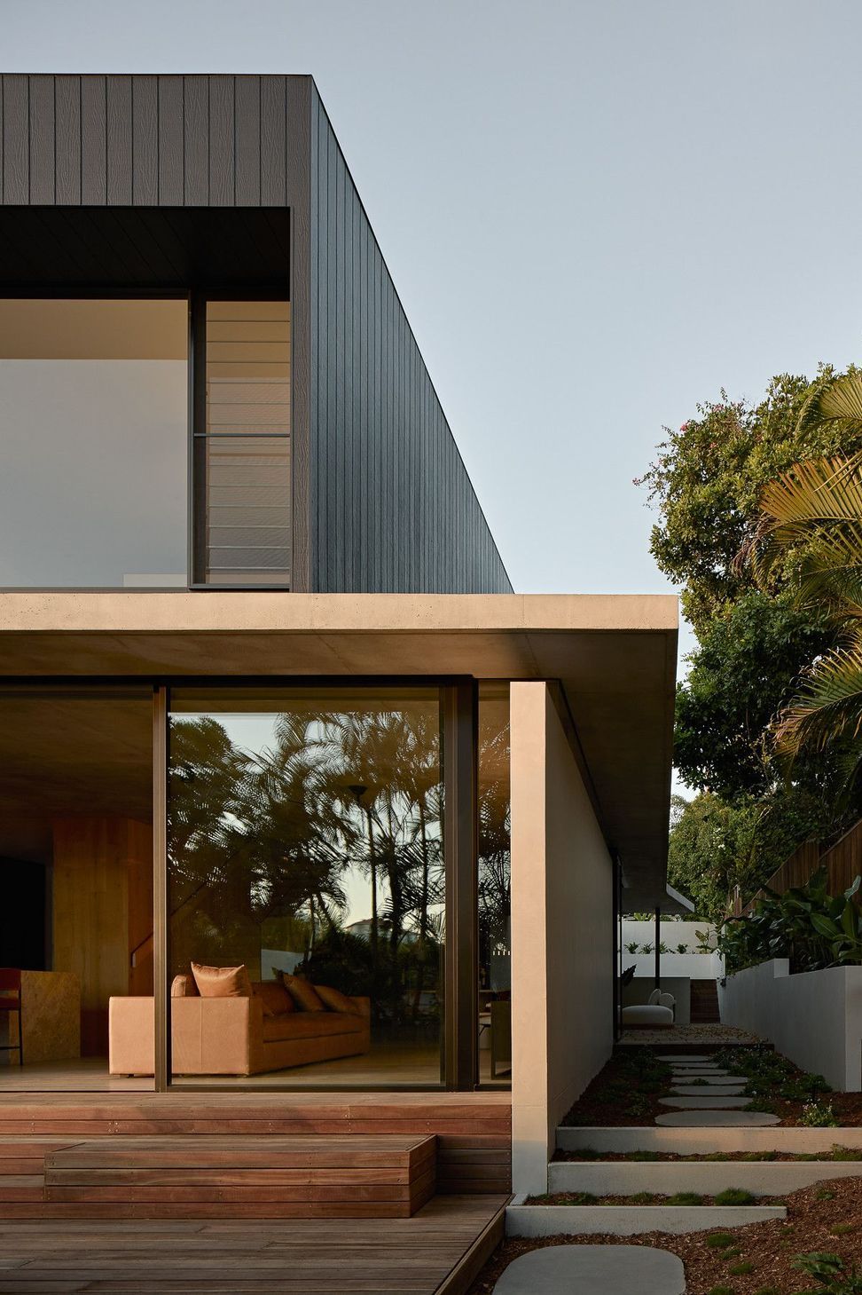 Wildflower Residence - Exterior. Rear elevation with a deep overhang and garden.