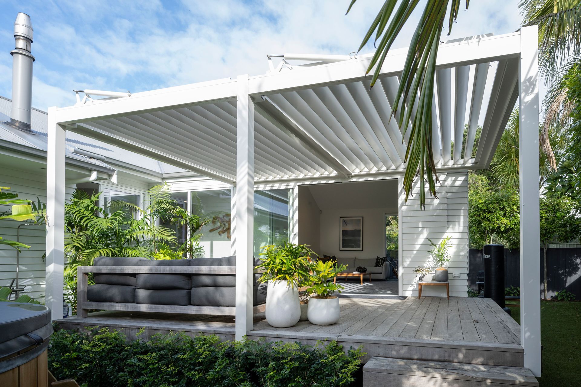 Auckland Home Project. Louvre Roof and Gate Create Oasis of Tranquility