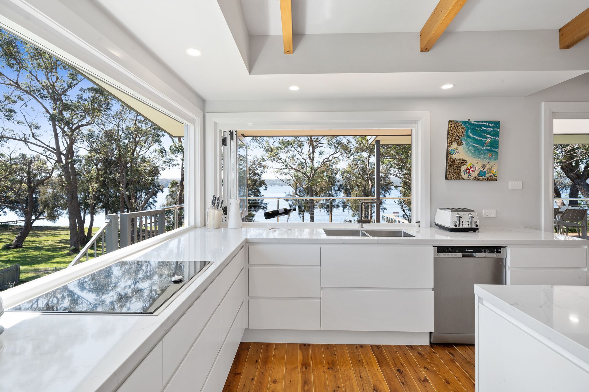 The playful bi-folding doors from the kitchen and large picture window make the kitchen the heart of the home and the views.