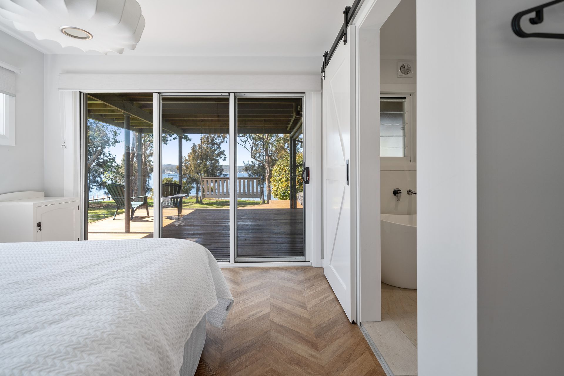 Warm timber floors throughout ground the interiors of this house.