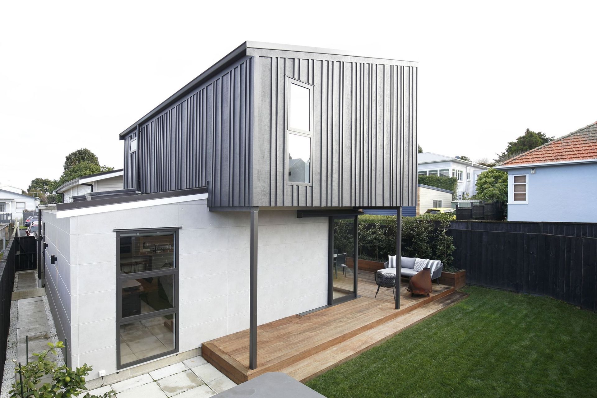 Concrete board and batten