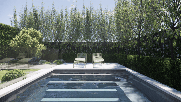 A rectangular swimming pool in a landscaped garden, viewed toward the far end from pool level. The pool has dark tiled walls and floor with broad pale horizontal steps or bands beneath the water, surrounded by a light paved coping. Two striped lounge chairs sit at the far edge, backed by dense hedges, tall slender trees, and mature garden planting in bright daylight.