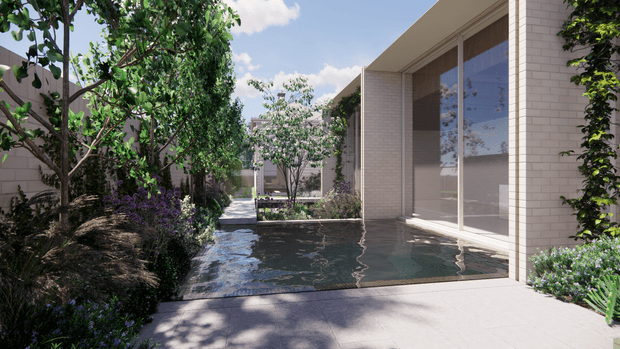 A tranquil landscaped courtyard beside a contemporary light-brick building, featuring a shallow reflective water feature, large floor-to-ceiling glazing, pale paved surfaces, climbing greenery, mature trees, and layered planting. The scene is bright and serene with strong indoor–outdoor connection.