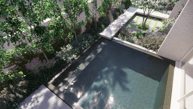 Elevated view of a landscaped courtyard pool area, showing a dark tiled swimming pool bordered by pale paving, dense planting, and raised garden beds enclosed by light brick walls.