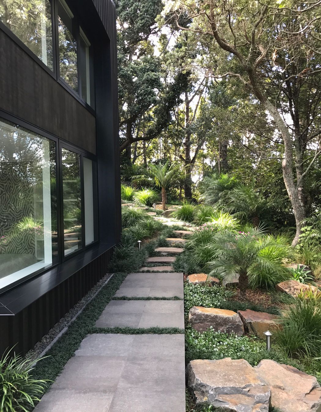 Stone pavers, stepping stones with native/subtropical planting