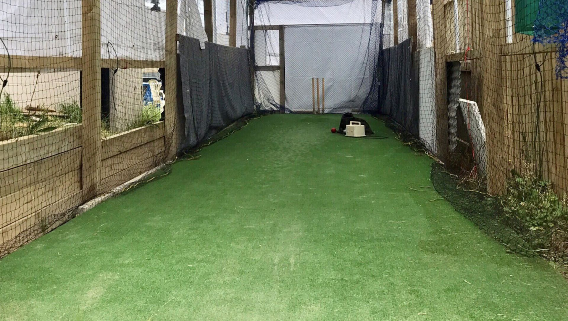 A cricket practice facility on home turf banner