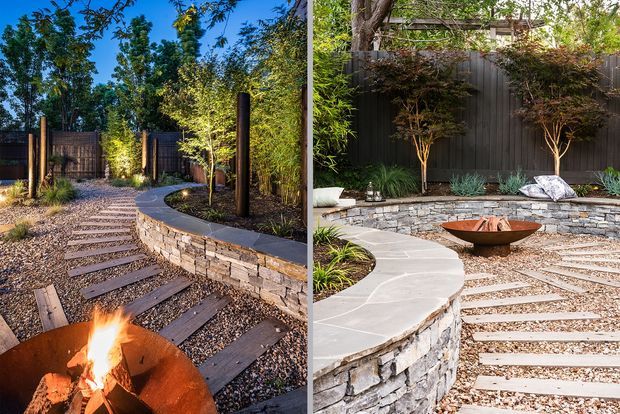 A landscaped outdoor courtyard or garden retreat with curved stone retaining walls, gravel paths and timber stepping planks, dark vertical fencing, planted borders, and sculptural fire bowls. The image presents two views of the same designed outdoor space, with a warm fire feature in the foreground and a low circular fire bowl in the second view.