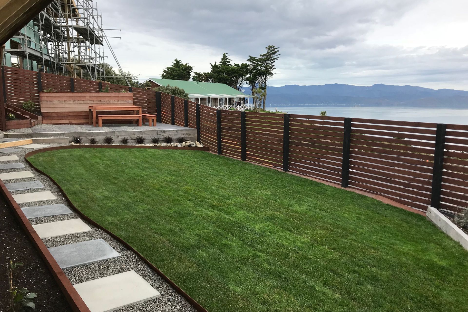 Garden with a view. A rear section filled with complimentary colours overlooking the Capital's harbour.