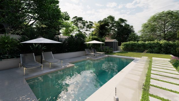 A landscaped outdoor swimming pool area with a rectangular turquoise pool, pale paved surrounds, sun loungers and umbrellas, dense tropical planting, hedges, and a stepping-stone lawn path.