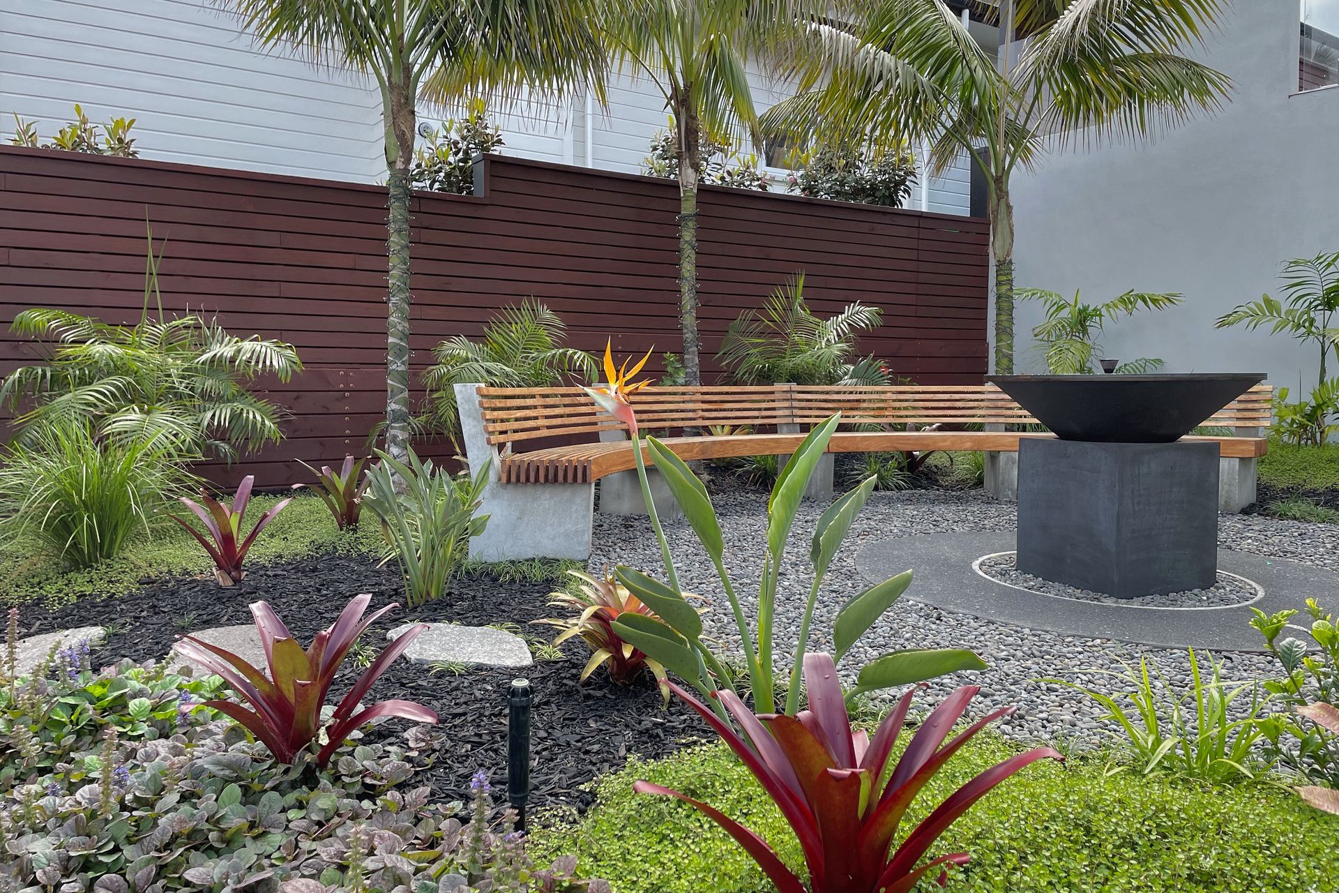Garden with fire pit and curved seating
