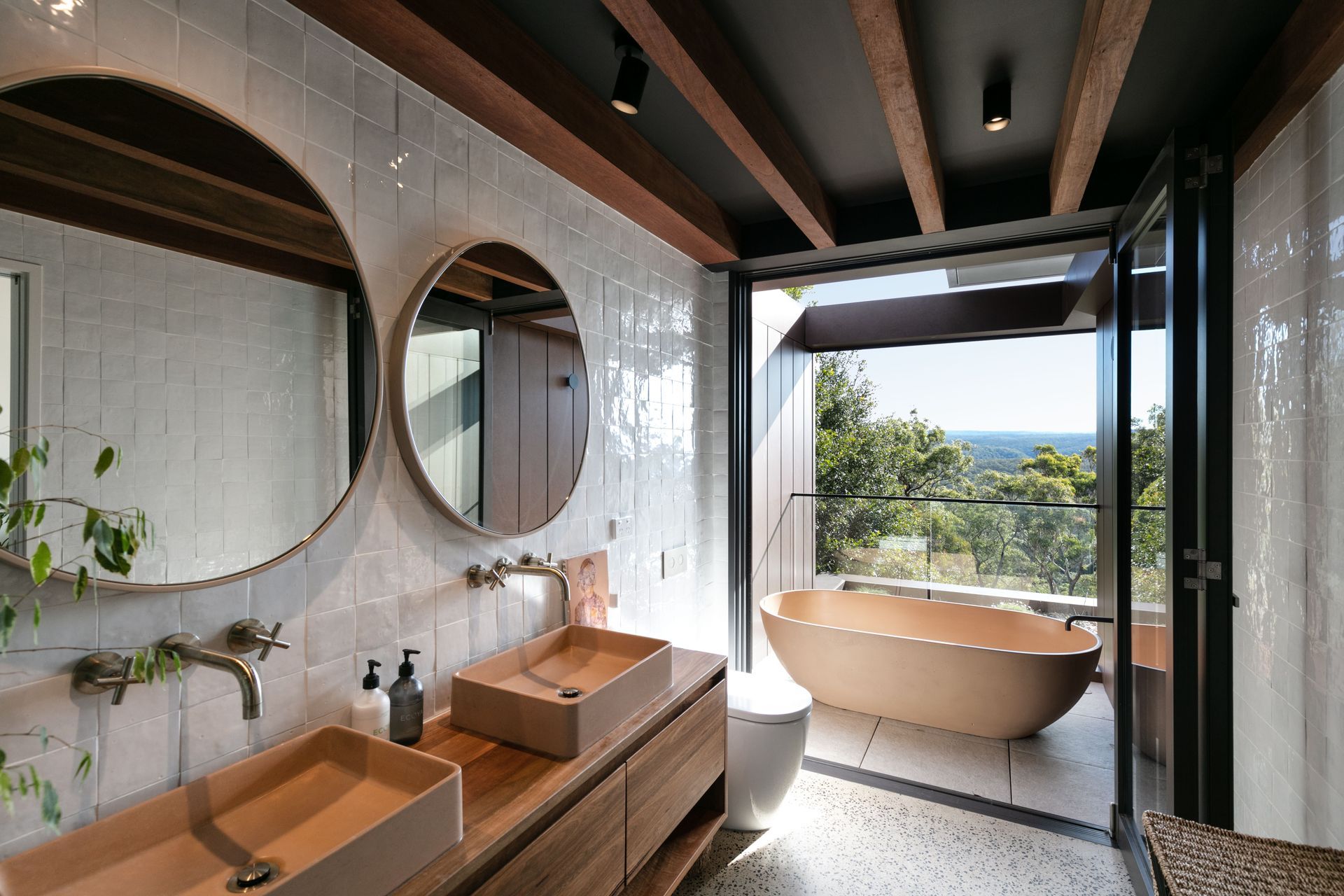 The exposed timber rafters and outdoor bath connect you with nature.