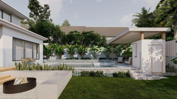 A landscaped residential courtyard viewed from an outdoor entertaining area, featuring a rectangular swimming pool, tropical planting, white rendered pavilion structures, a covered outdoor lounge, and a built-in circular fire pit in the foreground. The architecture has clean contemporary lines and a low-pitched tiled roof visible behind the courtyard.