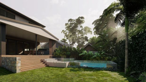 Exterior view of a contemporary low-pitched residence opening onto a landscaped garden. The home features broad roof overhangs, dark-framed glazing, a timber-clad deck and steps, stone retaining elements, dense tropical planting, and a small blue-lined pool or water feature.