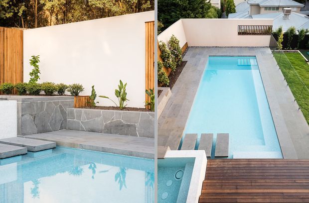 A split-view presentation of a landscaped residential swimming pool courtyard. The images show a pale blue rectangular pool with broad grey stone paving, timber decking, rendered privacy walls, timber fencing, planted garden beds, and built-in pool steps. The upper view also reveals neighbouring residential roofs and lawns beyond the enclosure.
