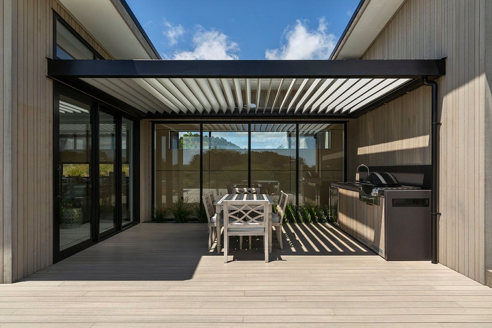 This fabulous outdoor kitchen and barbecue area is the prefect sheltered spot for summer entertaining.