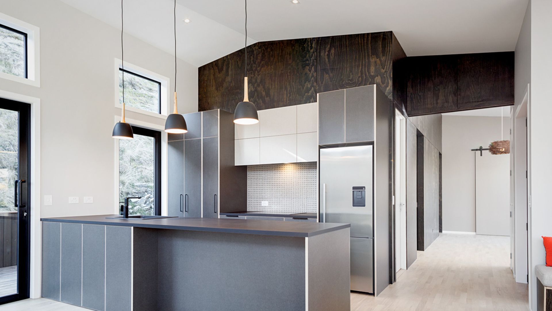 A striking feature wall in black satin plywood banner