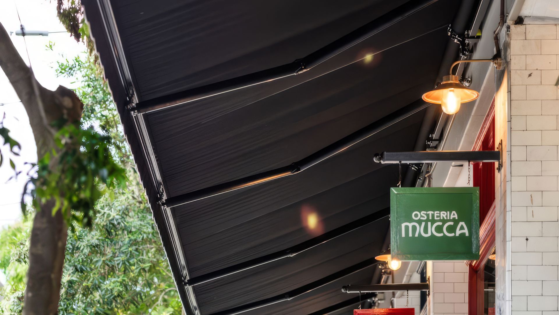 Shading the Streetscape – Aria Folding Arm Awning at H. May Precinct, Newtown banner