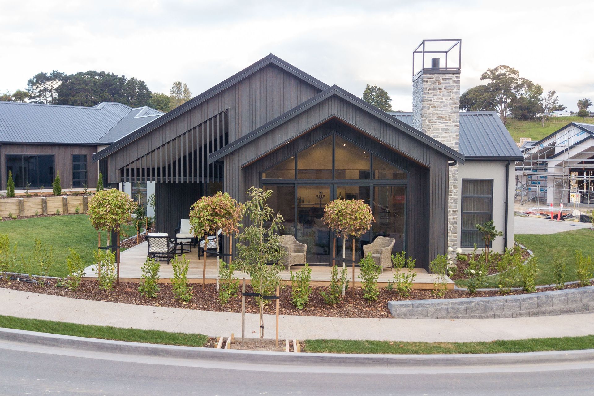 Stained cedar and schist stone provide a modern aesthetic.