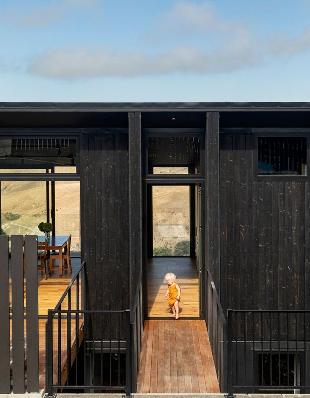 In response to keeping the footprint as light as possible, an air-bridge links the parking pad to the front door.