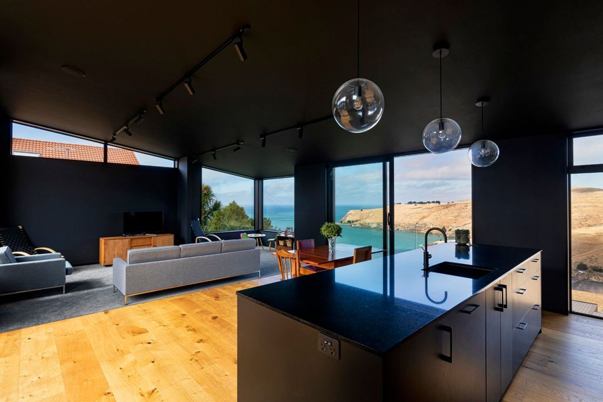 At the request of the owners, the walls and ceiling in the living area have been painted black to impart a sense of being inside one of the many caves found in the area.