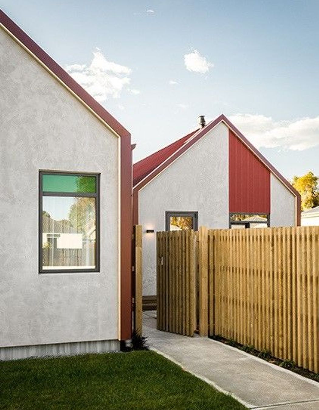 The gable ends are constructed from a lightweight concrete panel system with a concrete plaster finish.