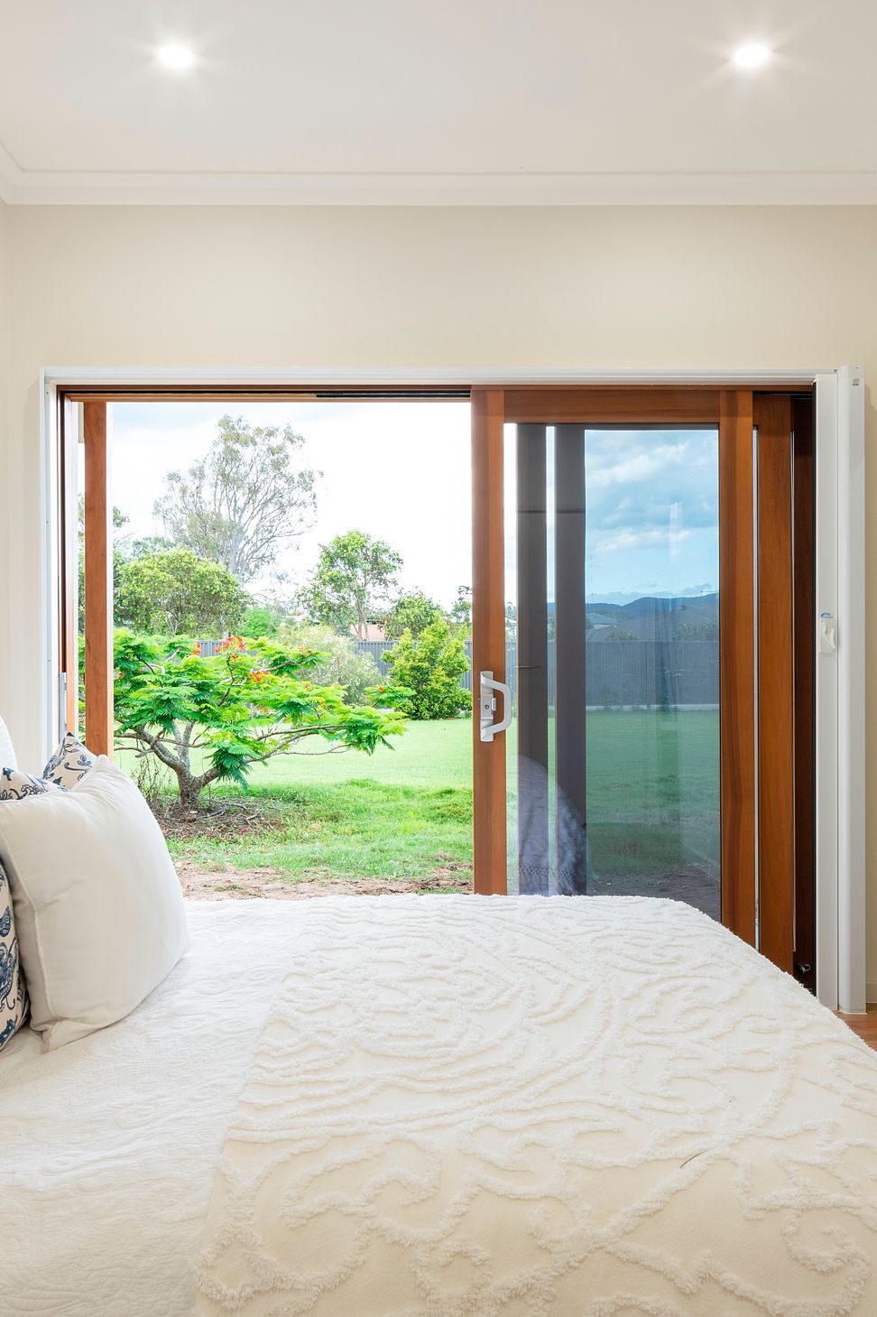 The bedroom is designed to allow a bedbound person to still experience a visual connection to the land. It is protected from western sun while still welcoming a generous winter warming. Photo:®Angus Martin