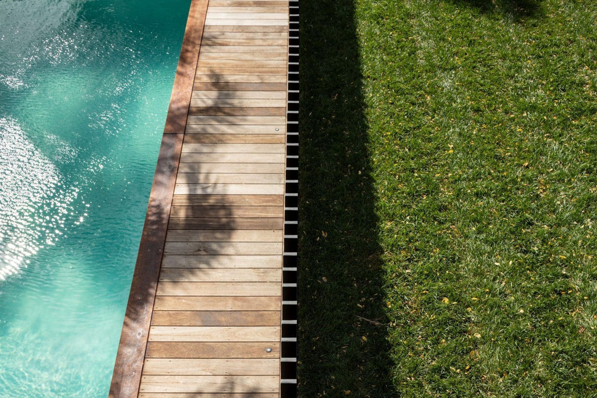 The home now directly connects to the backyard pool.