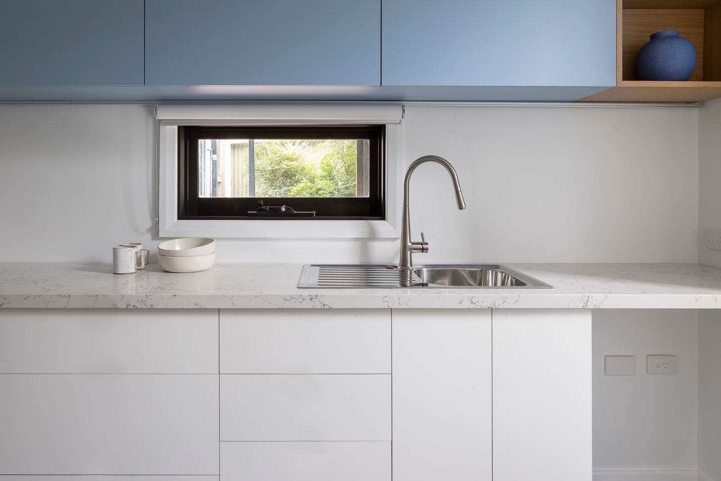 Cool blue, clean kitchenette
