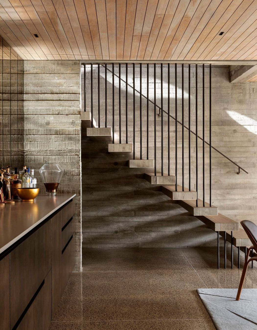 The architect's vision was to provide opportunities for natural light to be brought into the built environment. Open risers on the stairs permit light and create shifting shadows throughout the day.